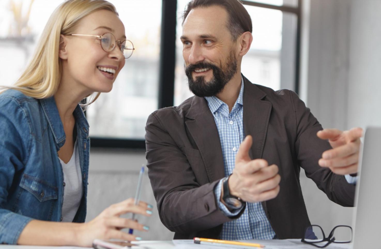Students engaged in interactive investment theory workshop